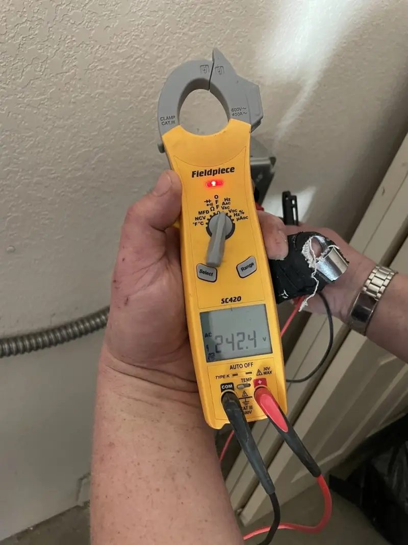 Voltage testing with clamp meter during Whole House Surge Protector in Norton